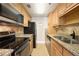 Efficient kitchen featuring granite countertops, stainless steel appliances, and ample cabinet space, perfect for culinary enthusiasts at 1280 W Peachtree Nw St # 1013, Atlanta, GA 30309
