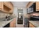 Efficient kitchen featuring granite countertops, stainless steel appliances, and ample cabinet space, perfect for culinary enthusiasts at 1280 W Peachtree Nw St # 1013, Atlanta, GA 30309
