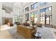 Expansive lobby featuring couches, chairs, tables, a piano, stairs, plants and recessed lights at 1280 W Peachtree Nw St # 1013, Atlanta, GA 30309