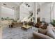 Expansive lobby featuring couches, chairs, tables, a piano, stairs, plants and recessed lights at 1280 W Peachtree Nw St # 1013, Atlanta, GA 30309