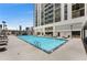 Beautiful outdoor pool with lounge chairs and a view of the city skyline at 1280 W Peachtree Nw St # 1013, Atlanta, GA 30309