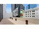 Modern rooftop patio with stunning city views, ideal for relaxing or entertaining in an urban setting at 1280 W Peachtree Nw St # 1013, Atlanta, GA 30309