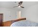 Bedroom features hardwood floors, ceiling fan, and closet space at 1380 Heritage Glen Dr, Marietta, GA 30068