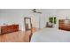 A spacious bedroom boasts hardwood floors, a four-poster bed, and natural light at 1380 Heritage Glen Dr, Marietta, GA 30068