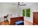 Bedroom with ample natural light, hardwood floors, and a ceiling fan at 1380 Heritage Glen Dr, Marietta, GA 30068