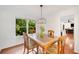 Charming dining room featuring a stylish light fixture and backyard views at 1380 Heritage Glen Dr, Marietta, GA 30068