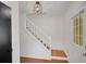 Bright foyer showcases hardwood floors and a staircase with white wooden banister at 1380 Heritage Glen Dr, Marietta, GA 30068