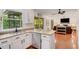Open kitchen with granite counters and stainless appliances offers a seamless transition to the living room at 1380 Heritage Glen Dr, Marietta, GA 30068