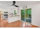 Stylish eat-in kitchen opens to a cozy screened porch, perfect for relaxing and enjoying the outdoors at 1380 Heritage Glen Dr, Marietta, GA 30068