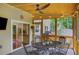 Inviting screened-in porch, perfect for dining and entertaining with a view of the backyard and the kitchen at 1380 Heritage Glen Dr, Marietta, GA 30068