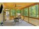 Enjoy the serene outdoors in this screened-in porch featuring a dining table and chairs, ideal for relaxation at 1380 Heritage Glen Dr, Marietta, GA 30068