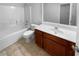 Well-maintained bathroom featuring a large vanity and tiled floors at 2586 Gristhaven Ln, Buford, GA 30519