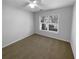 Comfortable bedroom with a ceiling fan and a large window at 2586 Gristhaven Ln, Buford, GA 30519