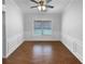 Dining room with natural light, wainscoting and ceiling fan at 2586 Gristhaven Ln, Buford, GA 30519