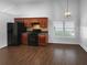 Cozy dining area with modern lighting, hardwood floors, and ample space for gatherings at 2586 Gristhaven Ln, Buford, GA 30519