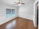 Dining room with natural light, wainscoting and ceiling fan at 2586 Gristhaven Ln, Buford, GA 30519