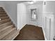 Foyer with wainscoting and staircase at 2586 Gristhaven Ln, Buford, GA 30519