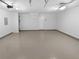 Spacious garage with epoxy floor and access door at 2586 Gristhaven Ln, Buford, GA 30519