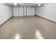 Spacious garage with two overhead doors, and an epoxy floor at 2586 Gristhaven Ln, Buford, GA 30519