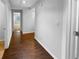 Hallway with hardwood floors leading to other rooms at 2586 Gristhaven Ln, Buford, GA 30519