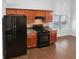 Kitchen featuring stainless steel appliances and wood cabinets at 2586 Gristhaven Ln, Buford, GA 30519