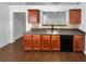 Kitchen featuring wood cabinets and black appliances at 2586 Gristhaven Ln, Buford, GA 30519