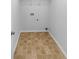 Compact laundry room with tiled floor and utility connections at 2586 Gristhaven Ln, Buford, GA 30519