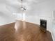 Bright living room with fireplace and hardwood floor before virtual staging at 2586 Gristhaven Ln, Buford, GA 30519