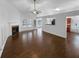 Spacious living room features hardwood floors, a fireplace, and plenty of natural light at 2586 Gristhaven Ln, Buford, GA 30519
