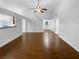 Open-concept living room with hardwood floors and recessed lighting at 2586 Gristhaven Ln, Buford, GA 30519