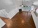 Open-concept living room with hardwood floors, fireplace, and plenty of space at 2586 Gristhaven Ln, Buford, GA 30519