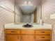 Bathroom with a vanity and drawers, a large mirror, and a shower-tub combination at 3809 Cotswold Sw Dr, Lilburn, GA 30047