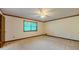 Bedroom with neutral walls, ceiling fan, and window at 3809 Cotswold Sw Dr, Lilburn, GA 30047