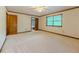 Bedroom features neutral carpet, window, and classic trim at 3809 Cotswold Sw Dr, Lilburn, GA 30047