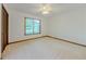 Bedroom with neutral walls, carpet, ceiling fan, and window at 3809 Cotswold Sw Dr, Lilburn, GA 30047