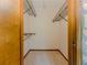 Walk-in closet with shelves and carpet at 3809 Cotswold Sw Dr, Lilburn, GA 30047