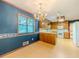 Charming dining room with a chandelier, offering a cozy atmosphere for meals near the kitchen and backyard at 3809 Cotswold Sw Dr, Lilburn, GA 30047