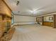 Bright living room with brick fireplace, ceiling fan, and a bar, perfect for entertaining at 3809 Cotswold Sw Dr, Lilburn, GA 30047