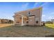 The backyard features a spacious lawn and a covered porch at 124 Dalston Cv, Stockbridge, GA 30281