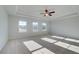Large bedroom features trey ceiling, ceiling fan, lots of light, and neutral carpet at 124 Dalston Cv, Stockbridge, GA 30281