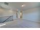 Neutral carpet in the upstairs loft area with plenty of natural light and access to other rooms at 124 Dalston Cv, Stockbridge, GA 30281