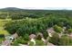 An aerial view of a neighborhood nestled among lush green trees at 1558 Ember Oaks Cir, Powder Springs, GA 30127