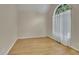 Bright room with hardwood floors, an arched window, and neutral walls; perfect for an office or reading nook at 1558 Ember Oaks Cir, Powder Springs, GA 30127