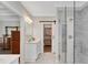 Gorgeous bathroom with a walk-in closet, walk-in shower, and marble countertop vanity at 753 Cambron Commons Trce, Suwanee, GA 30024