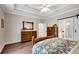 Well-lit bedroom with hardwood floors and access to the bathroom with glass shower at 753 Cambron Commons Trce, Suwanee, GA 30024