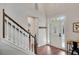 Elegant foyer with stairs, hardwood floors, and a view of the entry door at 753 Cambron Commons Trce, Suwanee, GA 30024