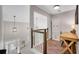 Spacious foyer with high ceilings, and desk and chair at 753 Cambron Commons Trce, Suwanee, GA 30024