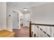 Hallway with hardwood floors, and interior doors at 753 Cambron Commons Trce, Suwanee, GA 30024