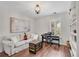 Cozy living room features a piano, couch, and decor at 753 Cambron Commons Trce, Suwanee, GA 30024