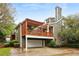 Rear exterior view with a large deck, outdoor living space and access to a garage, perfect for entertaining at 963 Manor Parc Dr, Decatur, GA 30033